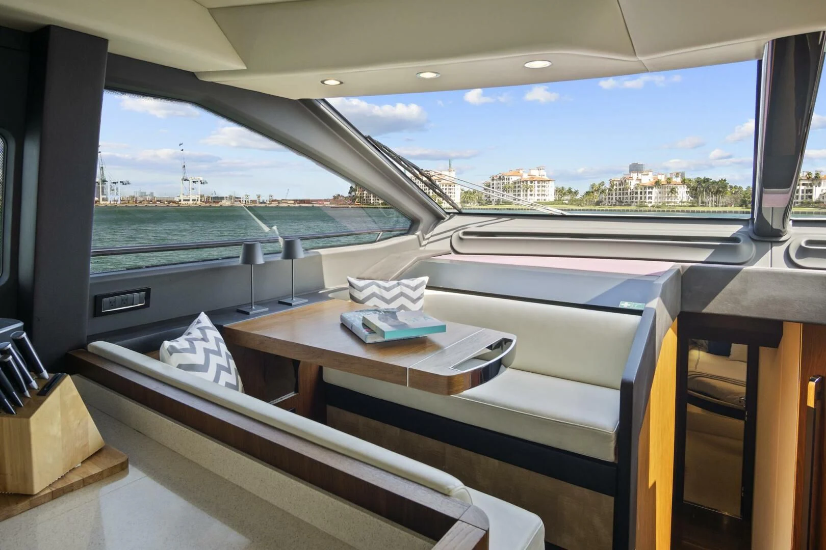 a room with a large window and a view of a city aboard GRATITUDE Yacht for Sale
