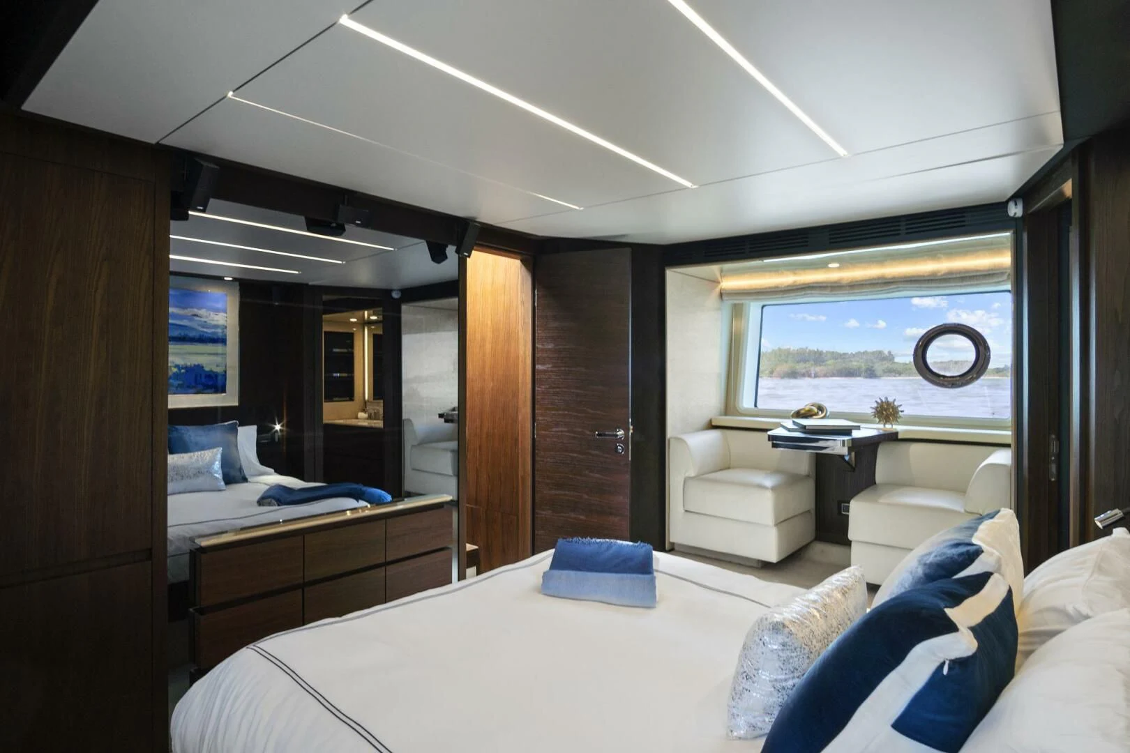 a room with a bed and a desk aboard GRATITUDE Yacht for Sale