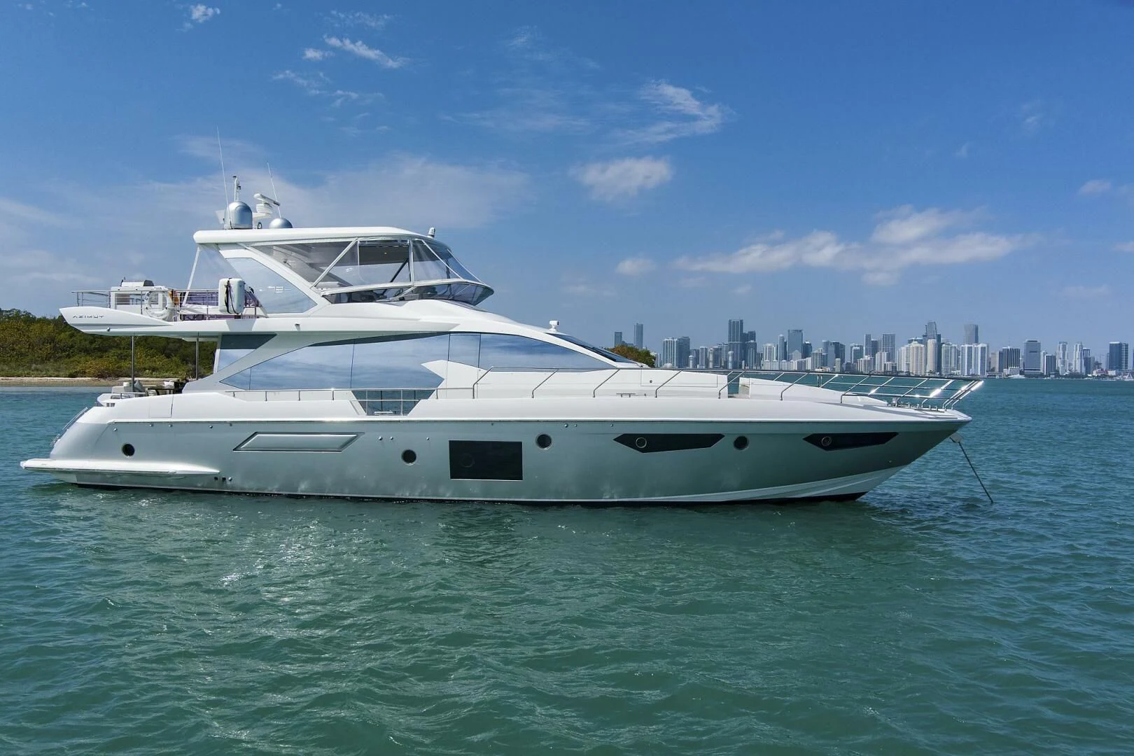 a white yacht in the water aboard GRATITUDE Yacht for Sale