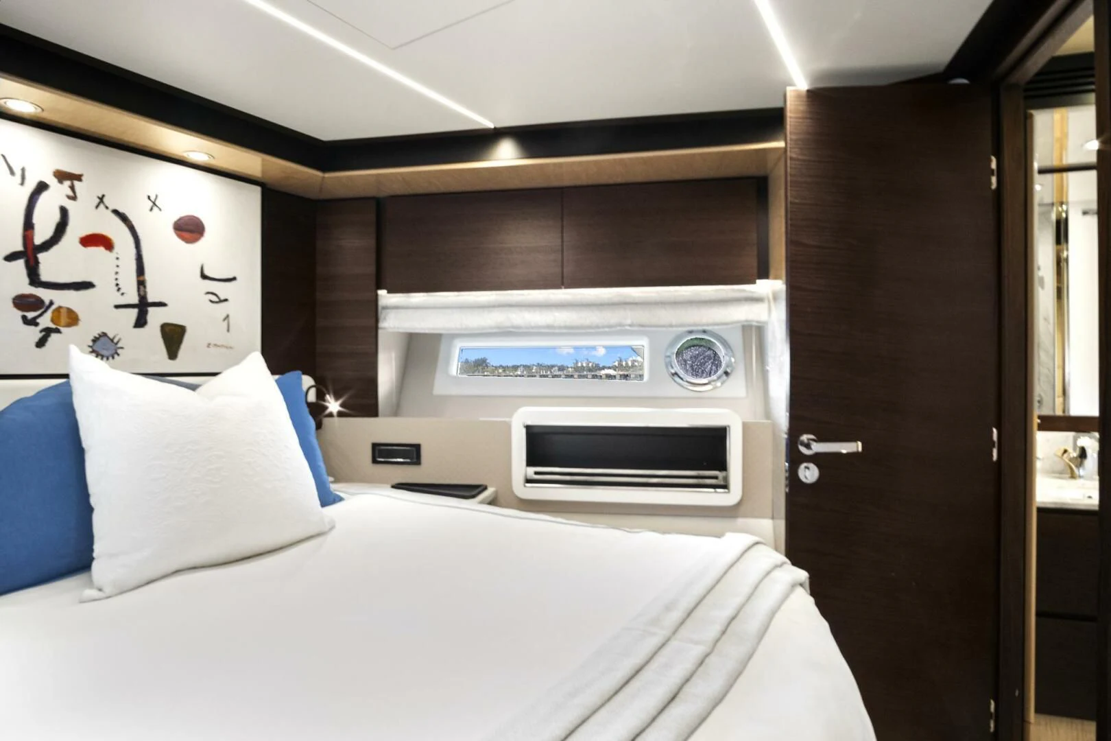 a bed and a microwave in a room aboard GRATITUDE Yacht for Sale