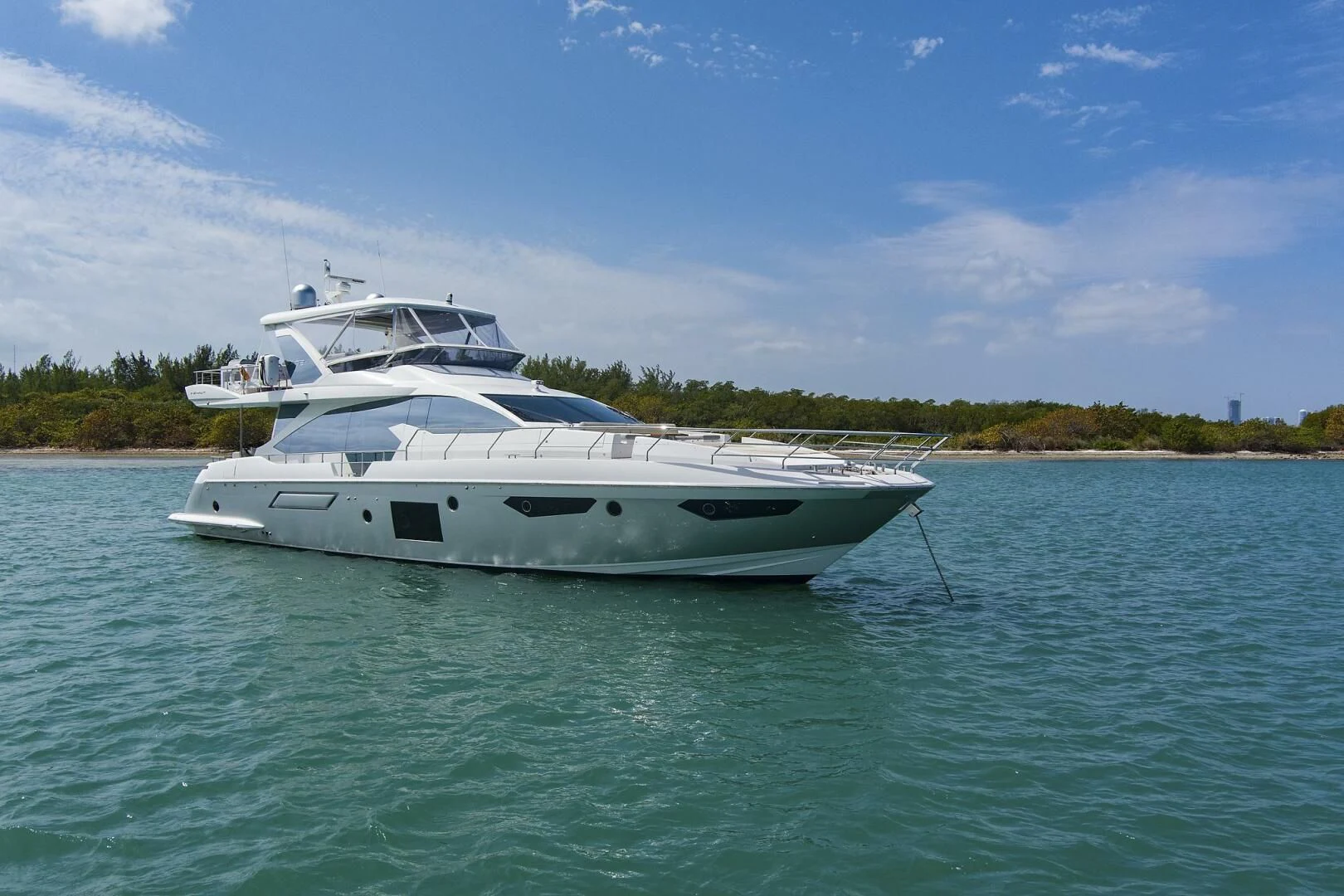 a white yacht in the water aboard GRATITUDE Yacht for Sale