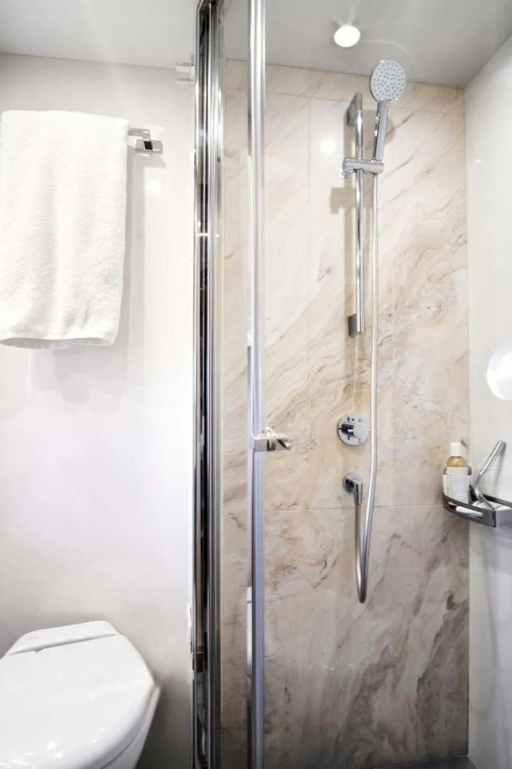 a bathroom with a shower and toilet aboard GRATITUDE Yacht for Sale