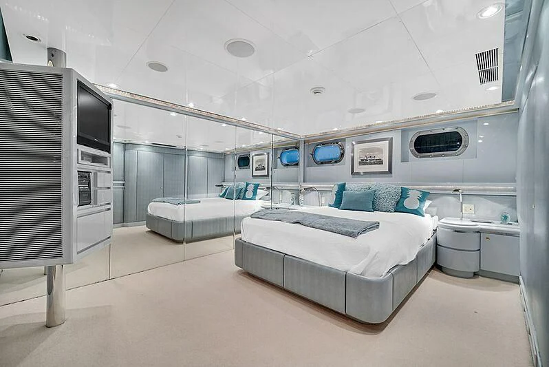 a room with a bed and a tv aboard MAVERICK Yacht for Charter