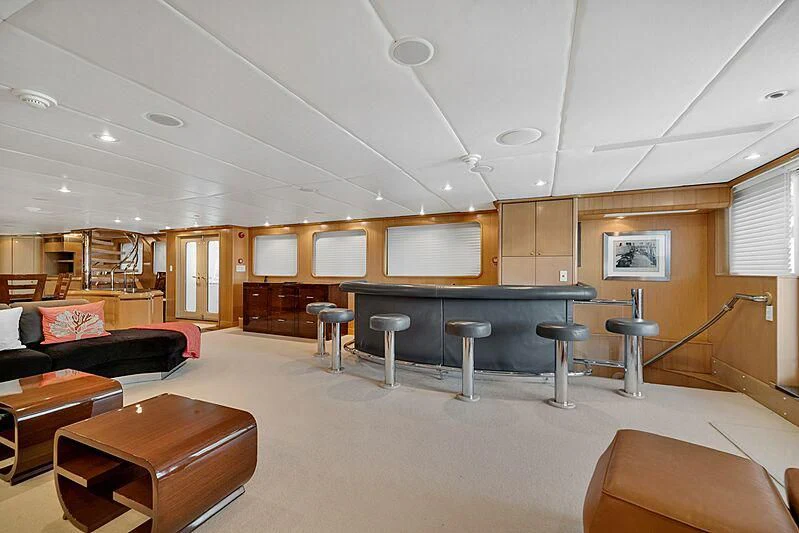 a room with a table and chairs aboard MAVERICK Yacht for Charter
