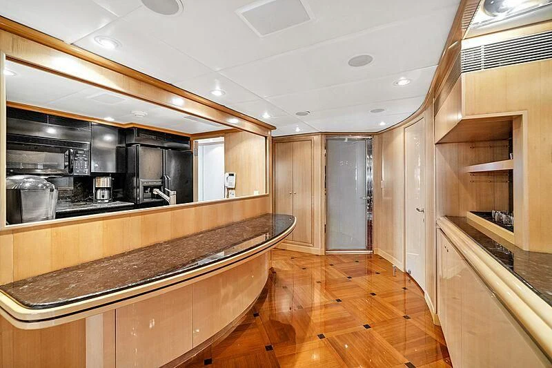 a kitchen with wooden cabinets aboard MAVERICK Yacht for Charter