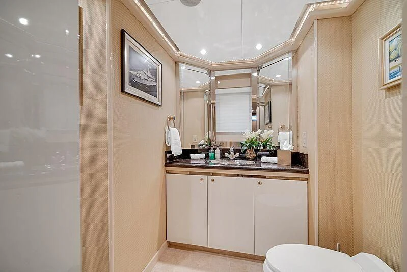 a bathroom with a sink and a mirror aboard MAVERICK Yacht for Charter
