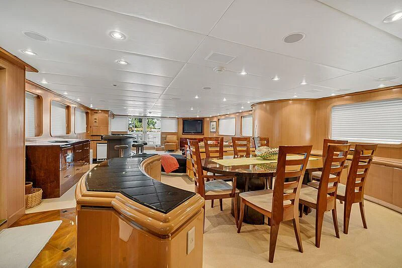 a kitchen with a table and chairs aboard MAVERICK Yacht for Charter