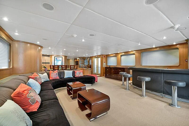 a living room with leather couches aboard MAVERICK Yacht for Charter