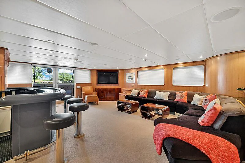 a living room with a couch and a tv aboard MAVERICK Yacht for Charter