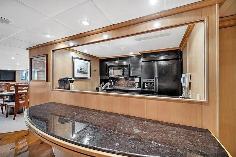 a kitchen with a large island aboard MAVERICK Yacht for Charter