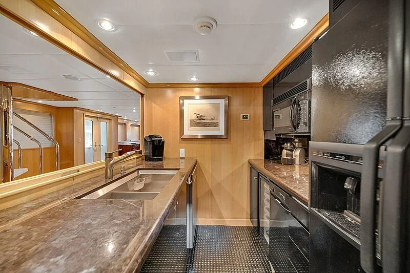 a kitchen with stainless steel appliances aboard MAVERICK Yacht for Charter