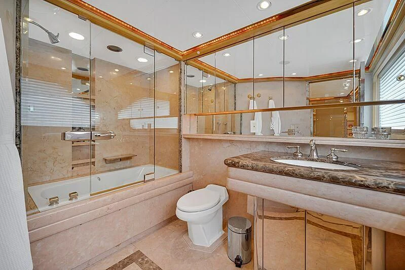 a bathroom with a large mirror aboard MAVERICK Yacht for Charter
