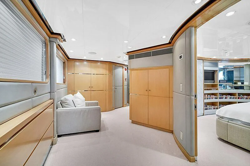 a room with a bed and a couch aboard MAVERICK Yacht for Charter