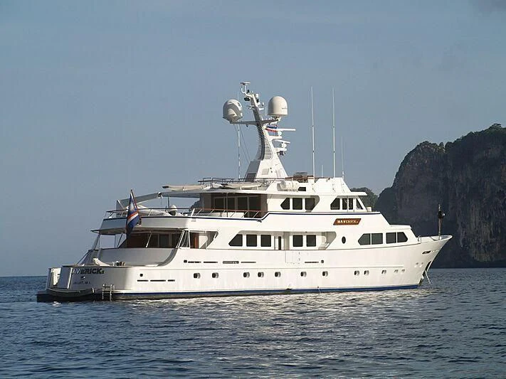a white boat in the water aboard MAVERICK Yacht for Charter