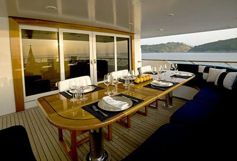 a table with plates and glasses on it aboard MAVERICK Yacht for Charter