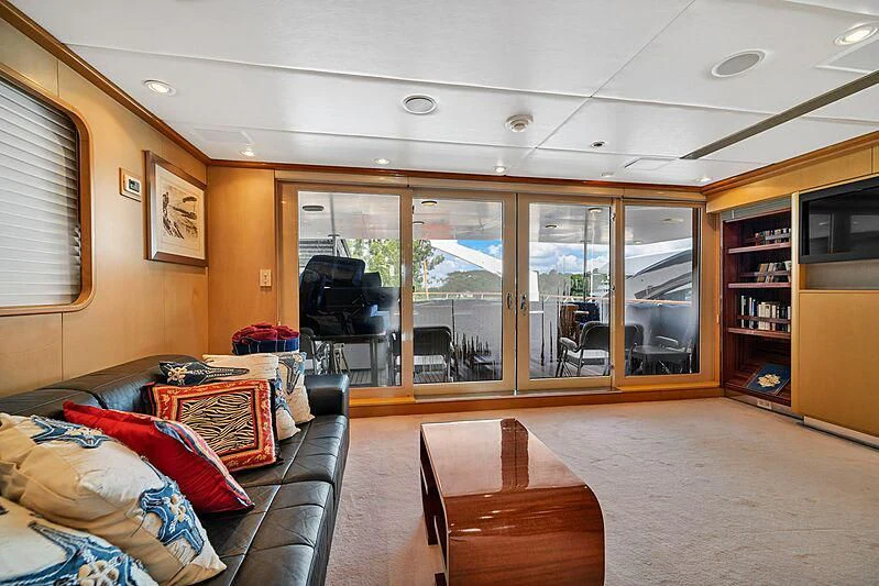 a living room with a leather couch aboard MAVERICK Yacht for Charter