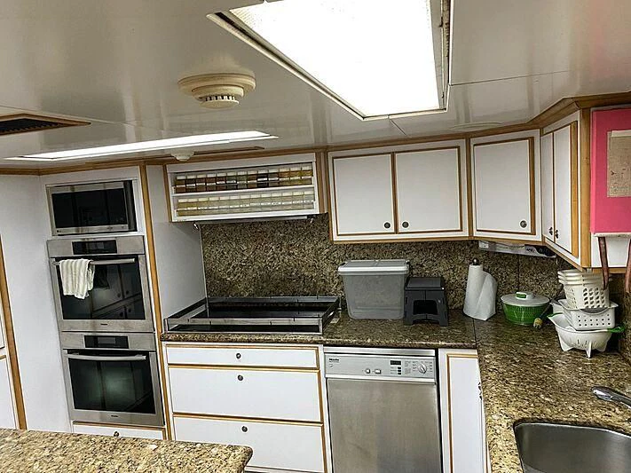 a kitchen with a microwave oven and a sink aboard MAVERICK Yacht for Charter