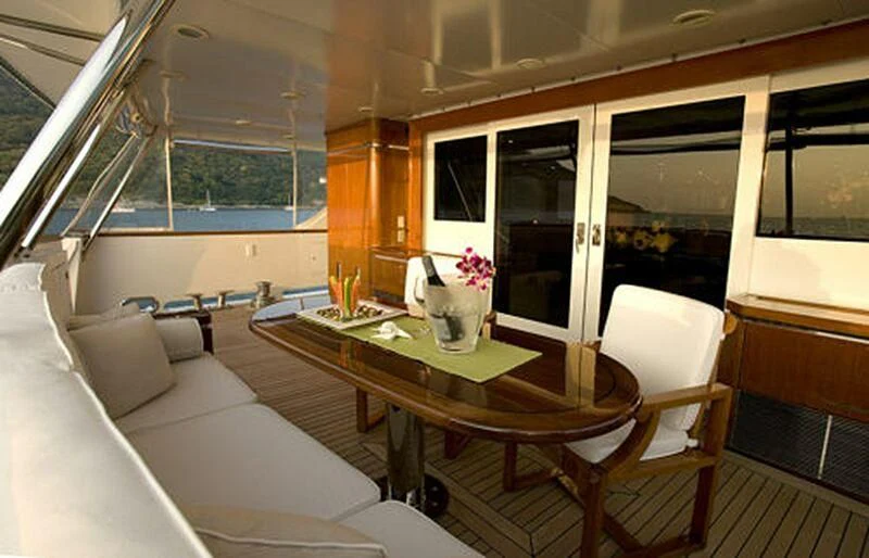 a room with a table and chairs aboard MAVERICK Yacht for Charter