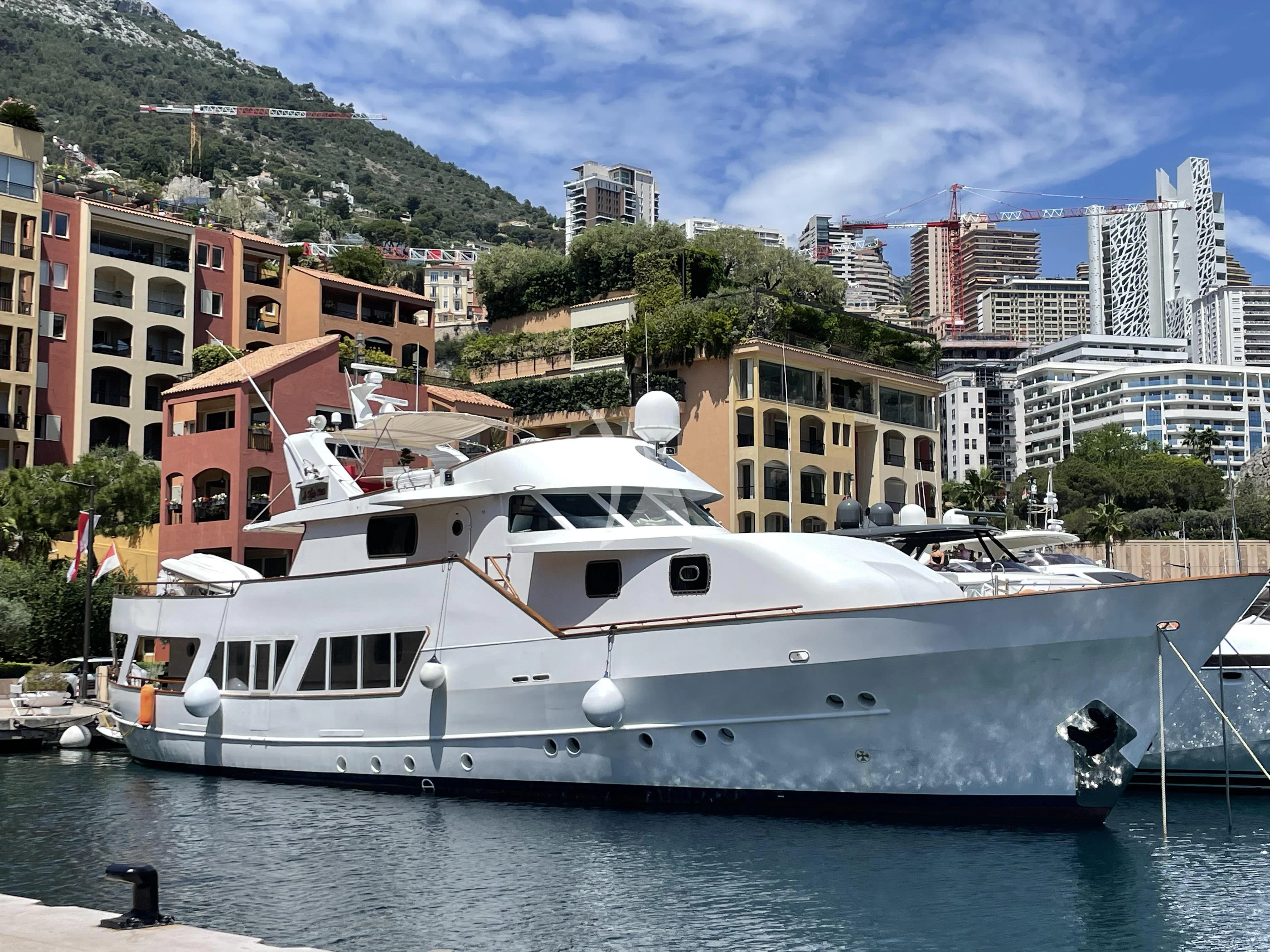 a white yacht in the water aboard LA VOGLIA MATTA Yacht for Charter