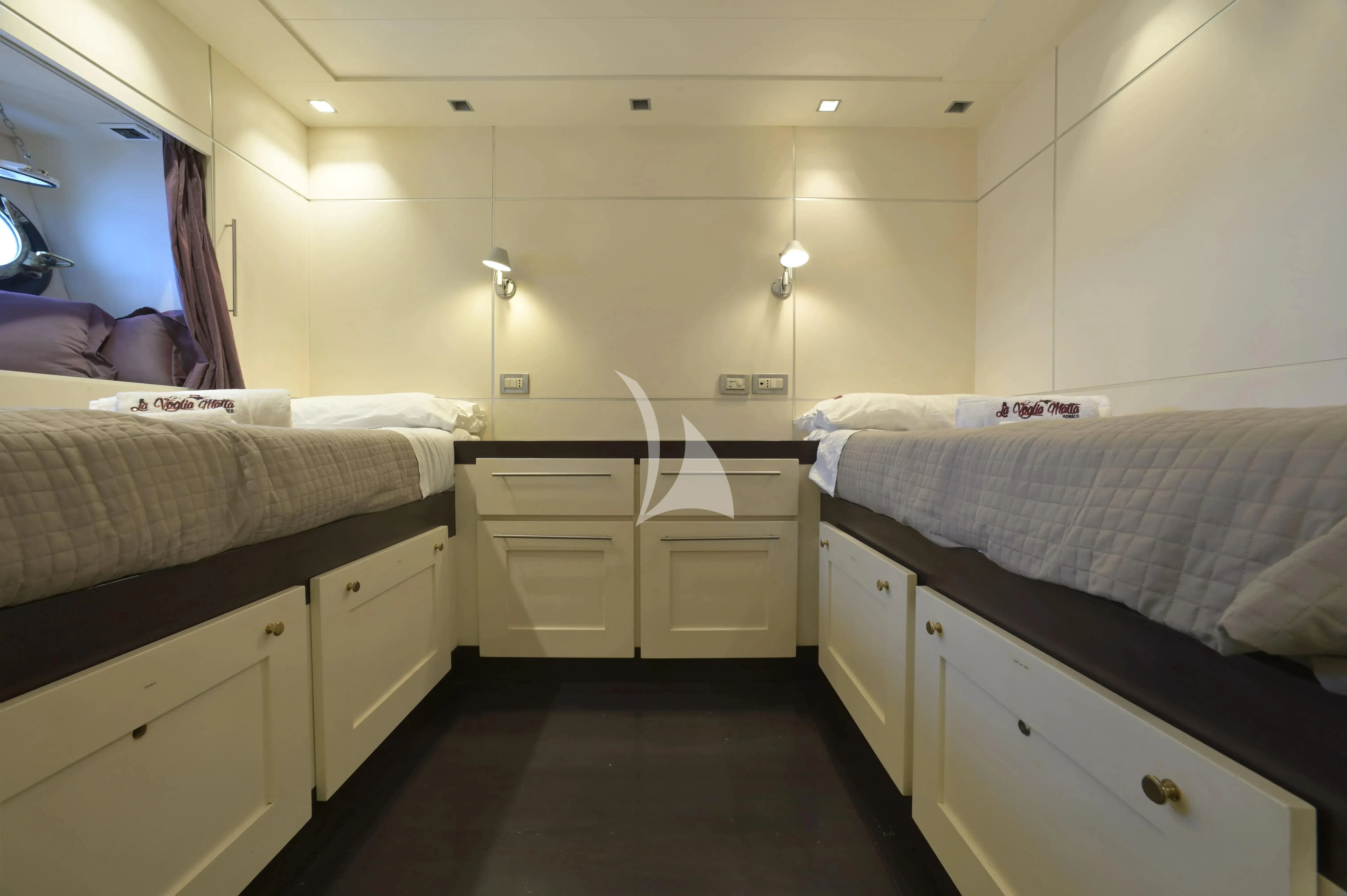 a room with white drawers aboard LA VOGLIA MATTA Yacht for Charter