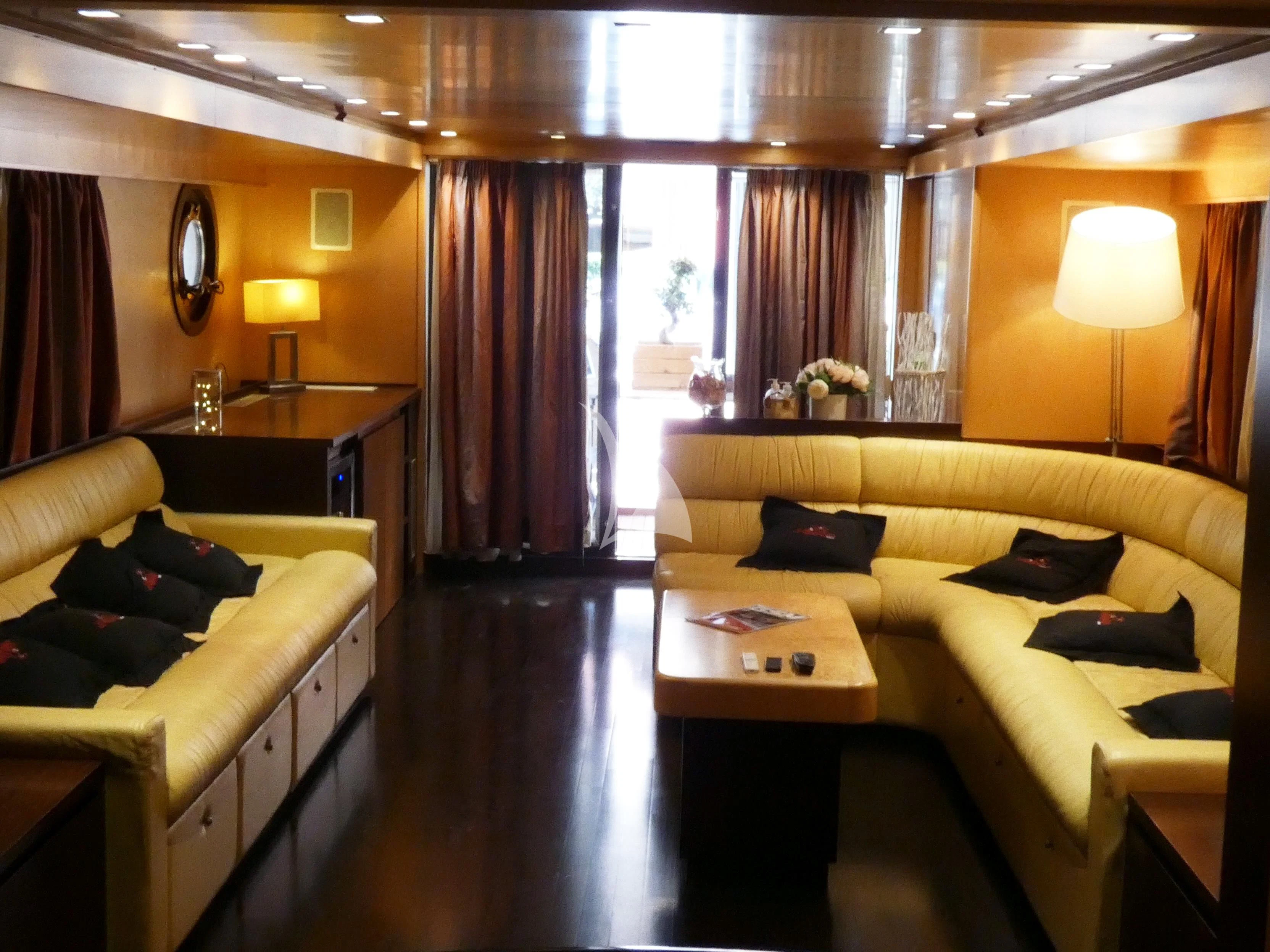a living room with a couch and a coffee table aboard LA VOGLIA MATTA Yacht for Charter