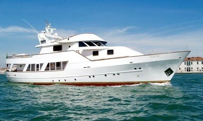 a white yacht in the water aboard LA VOGLIA MATTA Yacht for Charter