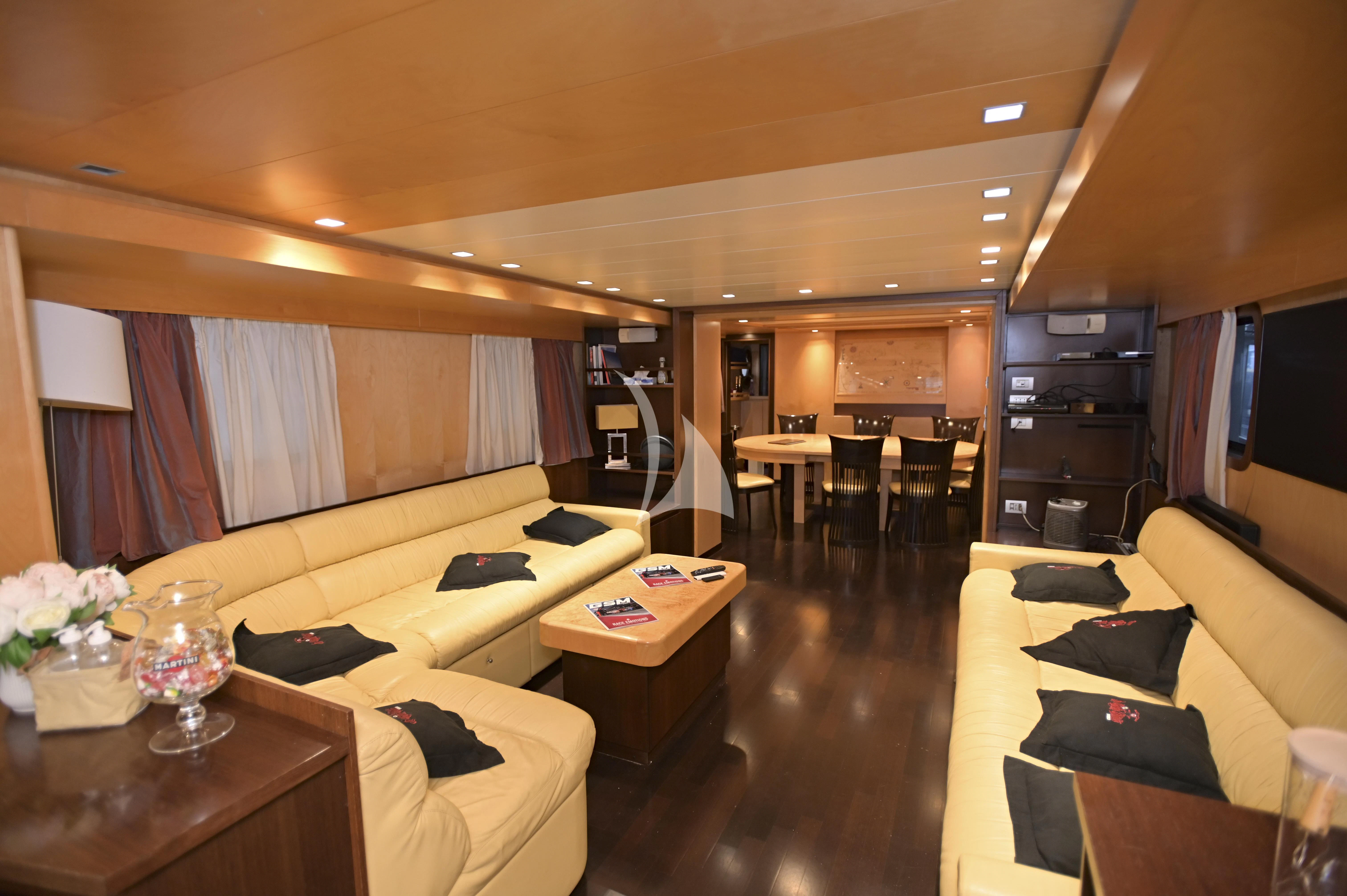 a living room with a couch and a coffee table aboard LA VOGLIA MATTA Yacht for Charter