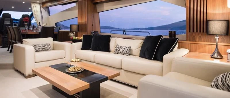 a living room with a large window aboard SPIRIT OF THE SEA Yacht for Sale