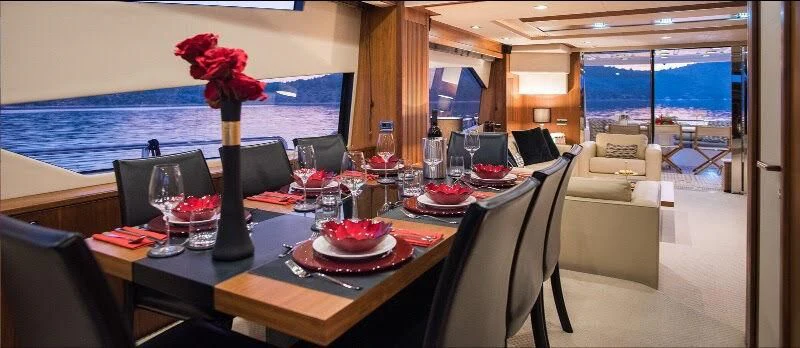 a table with food and drinks on it aboard SPIRIT OF THE SEA Yacht for Sale