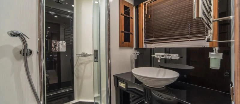 a bathroom with a sink and a mirror aboard SPIRIT OF THE SEA Yacht for Sale
