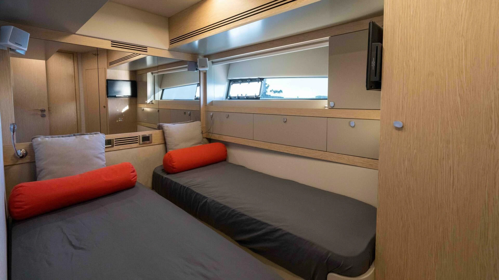 a room with a bed and a couch aboard ADONIS Yacht for Sale