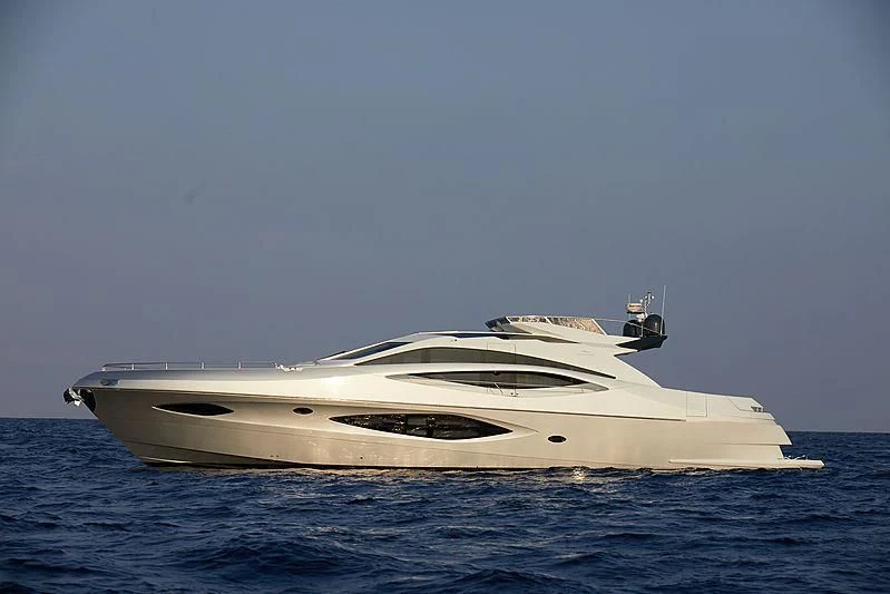 a white yacht in the water aboard ADONIS Yacht for Sale