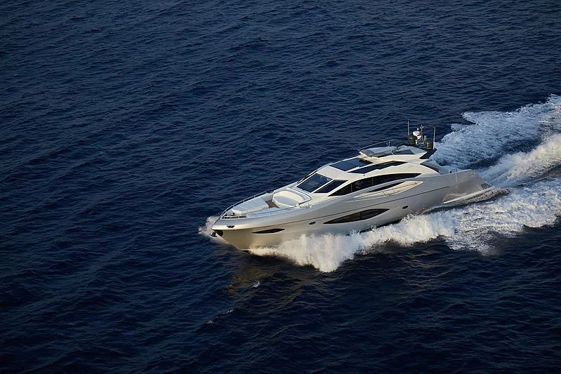 a white yacht on the water aboard ADONIS Yacht for Sale