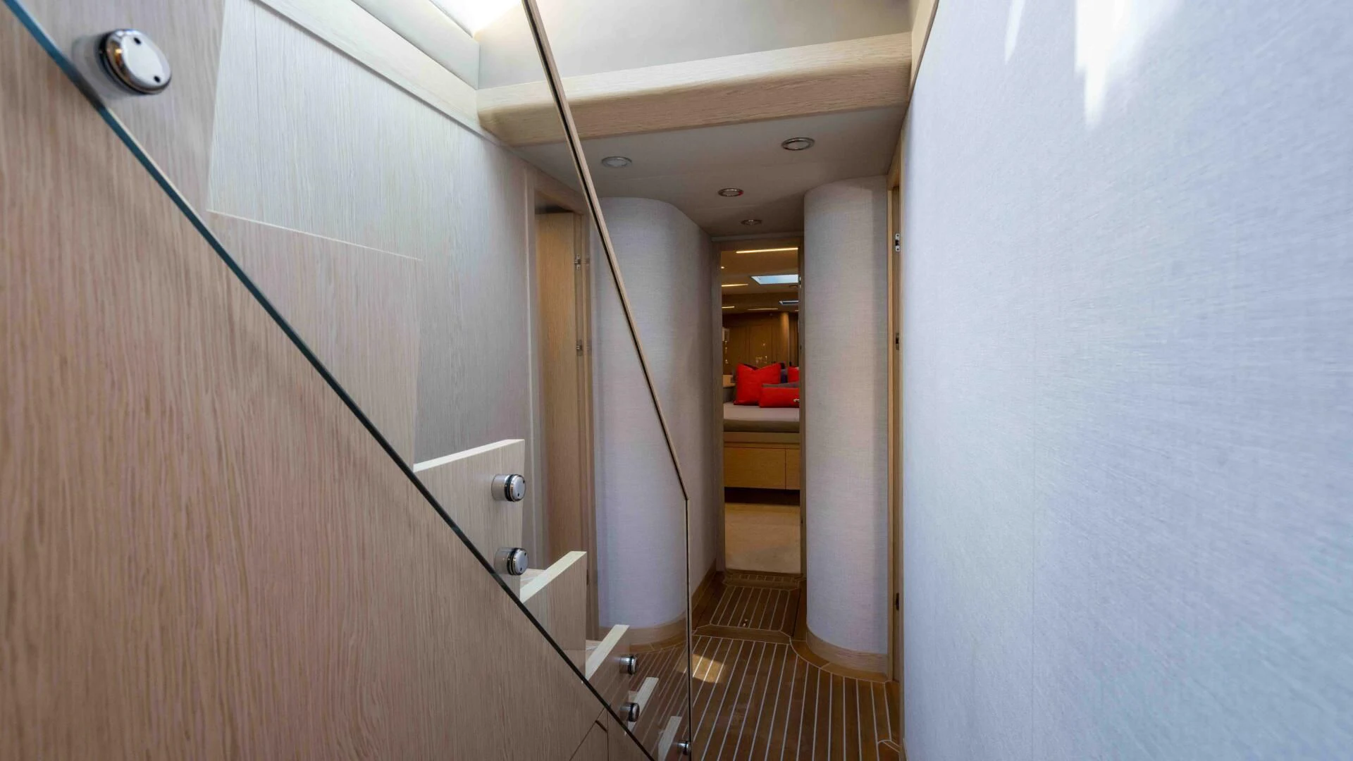 a hallway with a door and a chair aboard ADONIS Yacht for Sale
