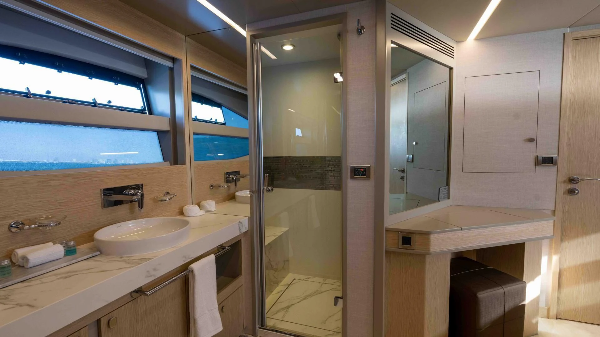 a bathroom with a sink and a mirror aboard ADONIS Yacht for Sale