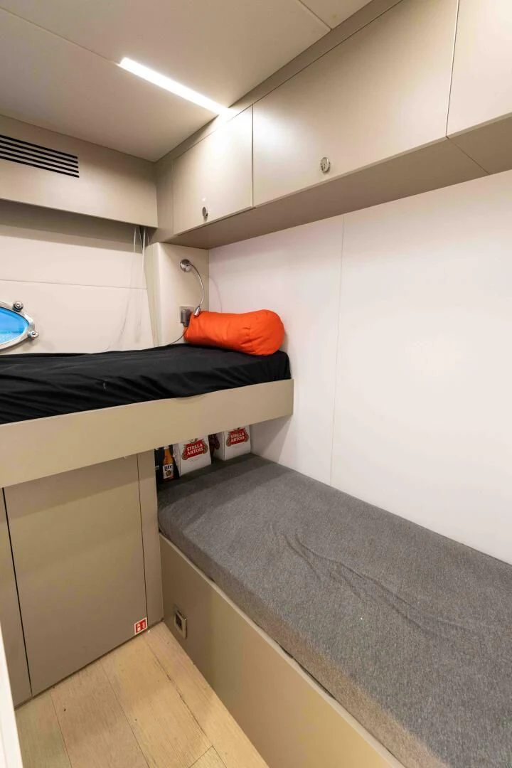 a room with a bed and a desk aboard ADONIS Yacht for Sale