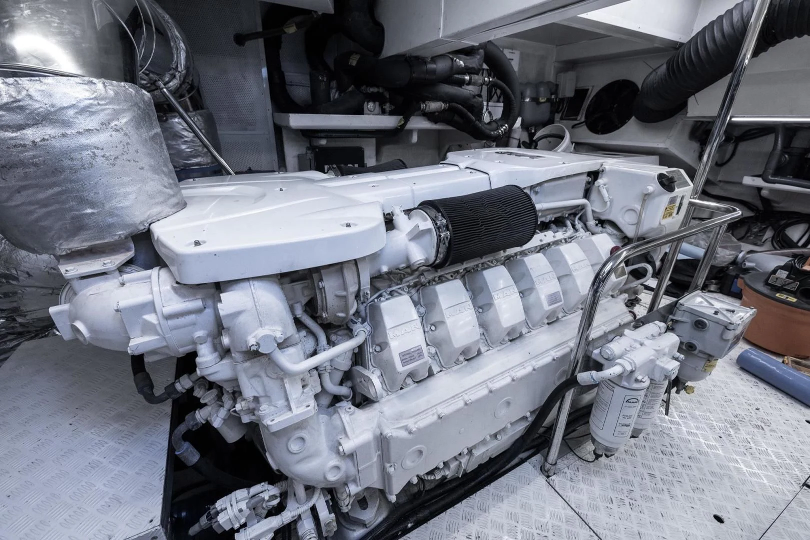 a machine with a large metal cylinder aboard ADONIS Yacht for Sale