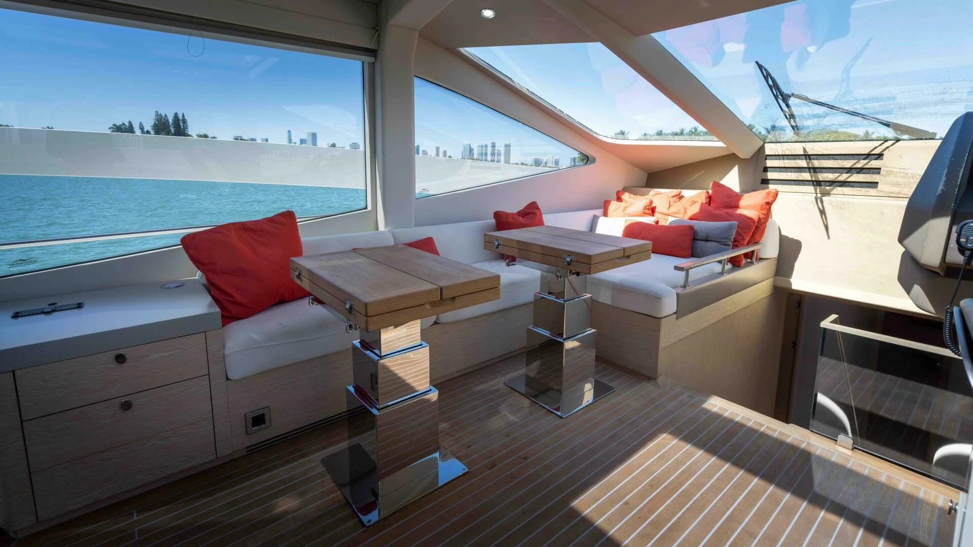 a room with a couch and a table and a window aboard ADONIS Yacht for Sale