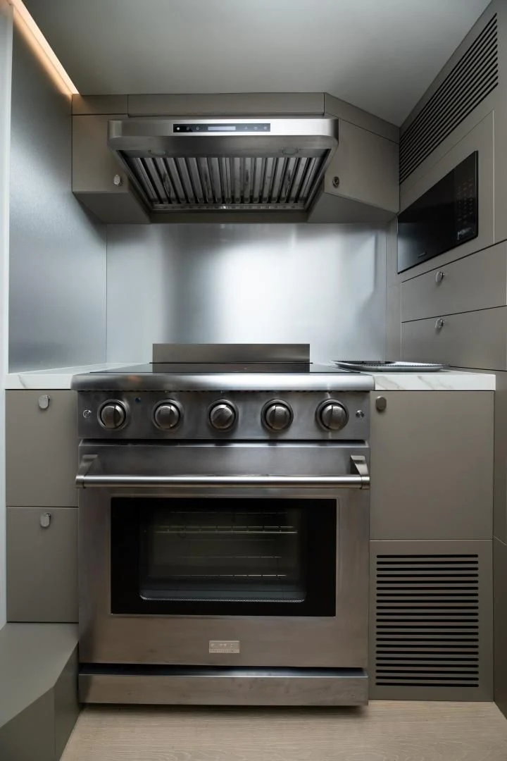 a stainless steel stove in a kitchen aboard ADONIS Yacht for Sale