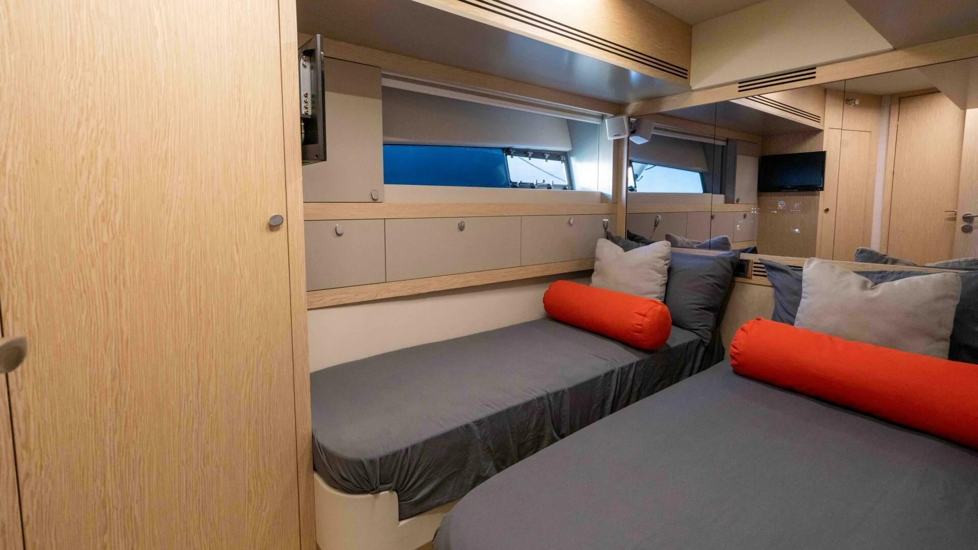 a room with a bed and a desk aboard ADONIS Yacht for Sale
