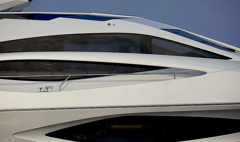 the side of a white car aboard ADONIS Yacht for Sale
