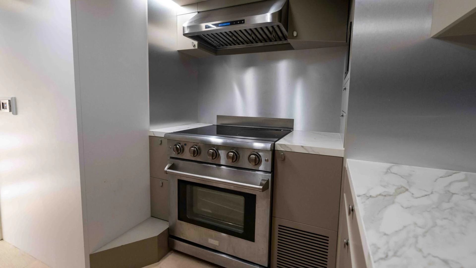 a kitchen with a stove and oven aboard ADONIS Yacht for Sale