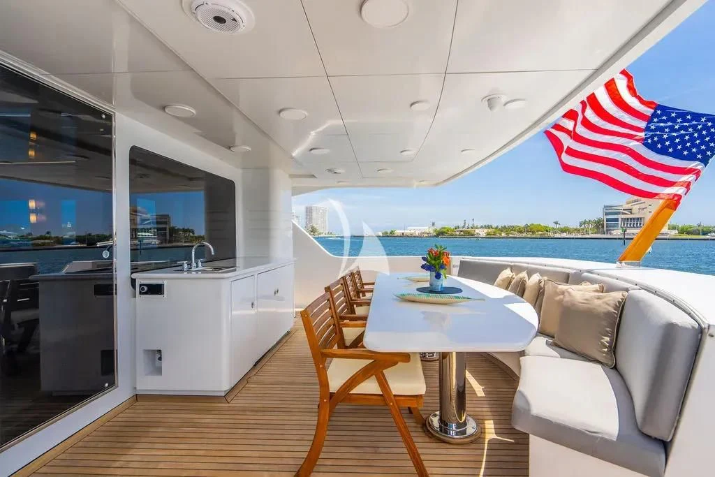 a room with a table and chairs aboard CARPE DIEM Yacht for Charter