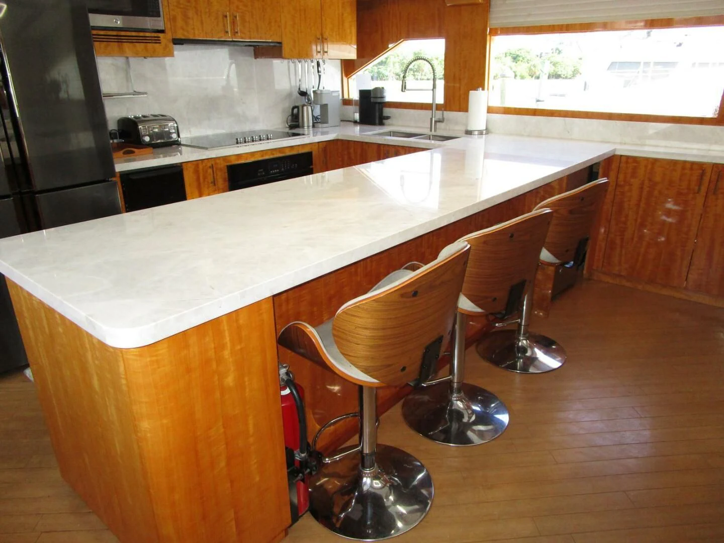 a kitchen with a table and chairs aboard CARPE DIEM Yacht for Charter