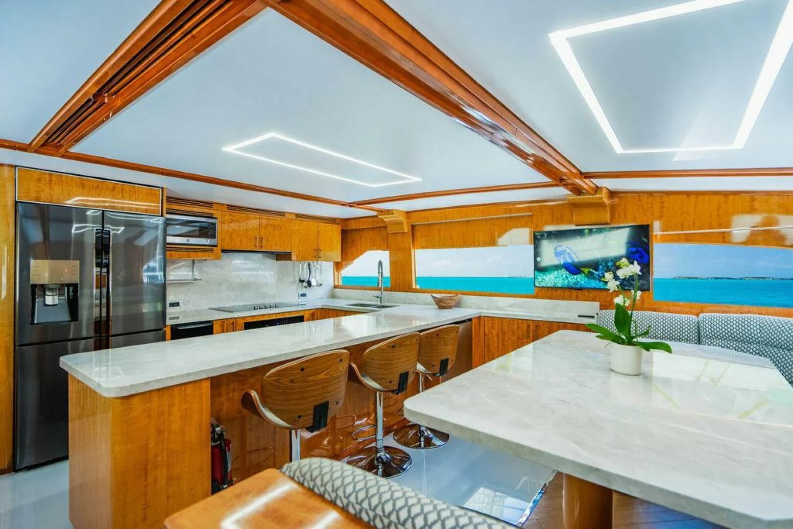 a kitchen with a large island aboard CARPE DIEM Yacht for Charter