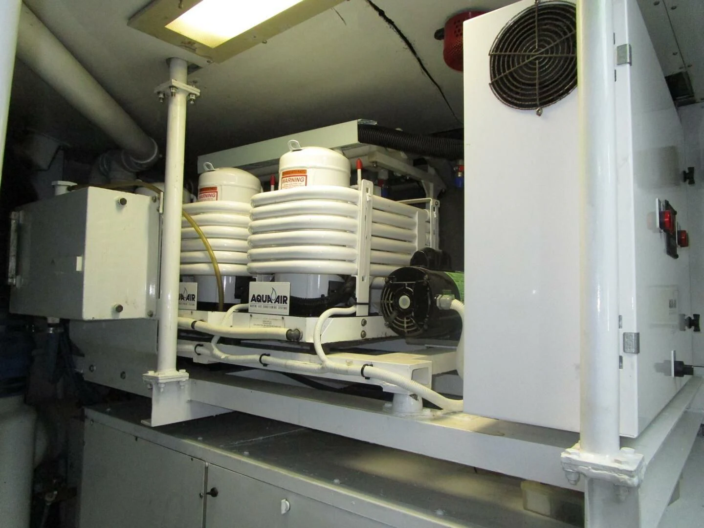 a machine with a large stack of white containers on the side aboard CARPE DIEM Yacht for Charter