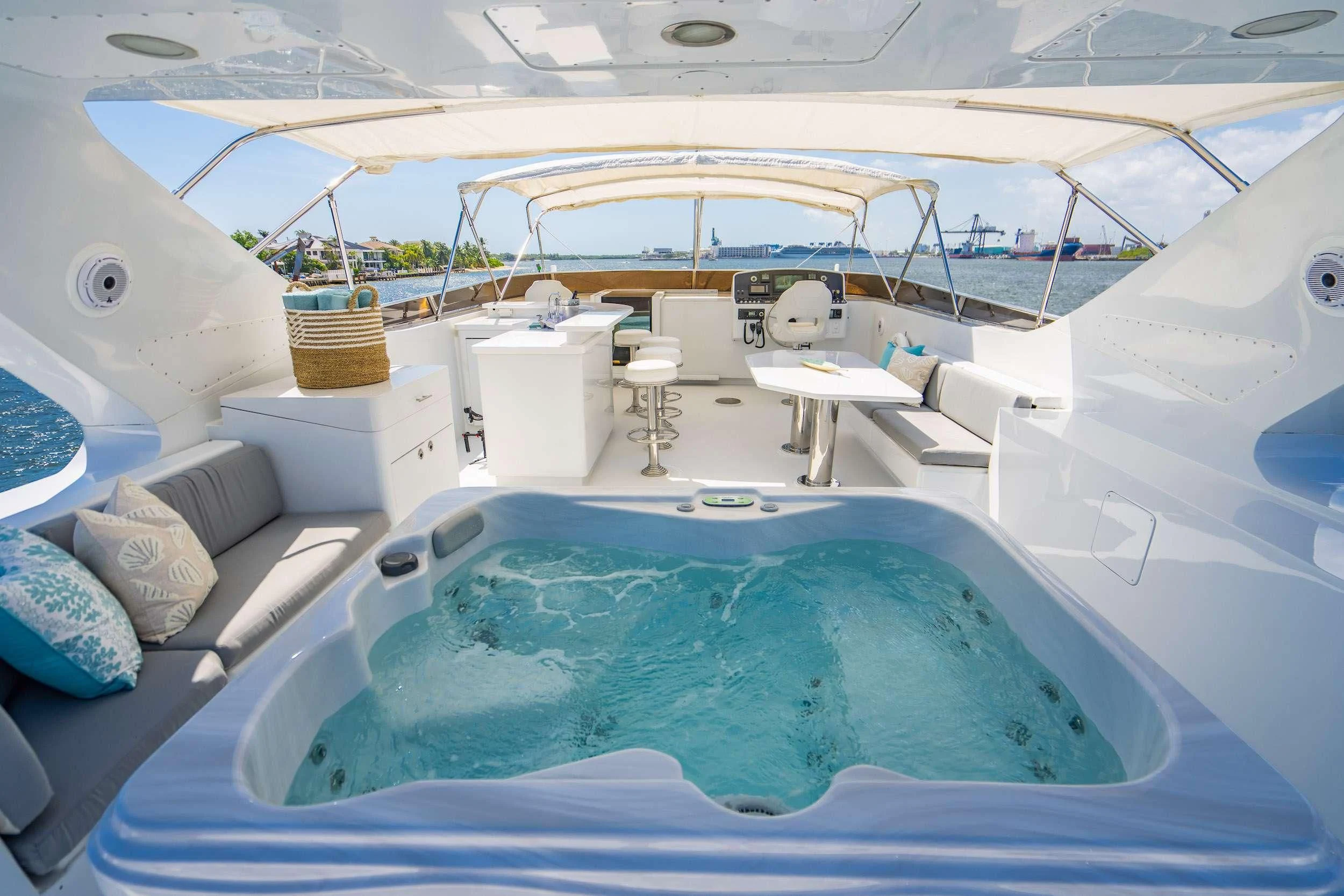 a boat with a table and chairs aboard CARPE DIEM Yacht for Charter