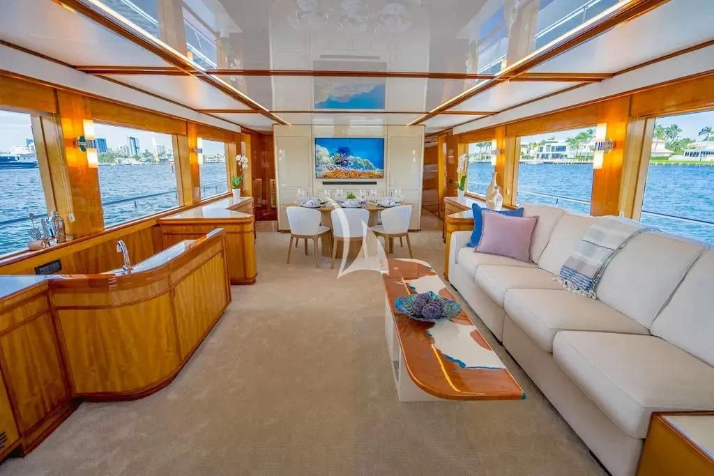 a living room with a large window aboard CARPE DIEM Yacht for Charter