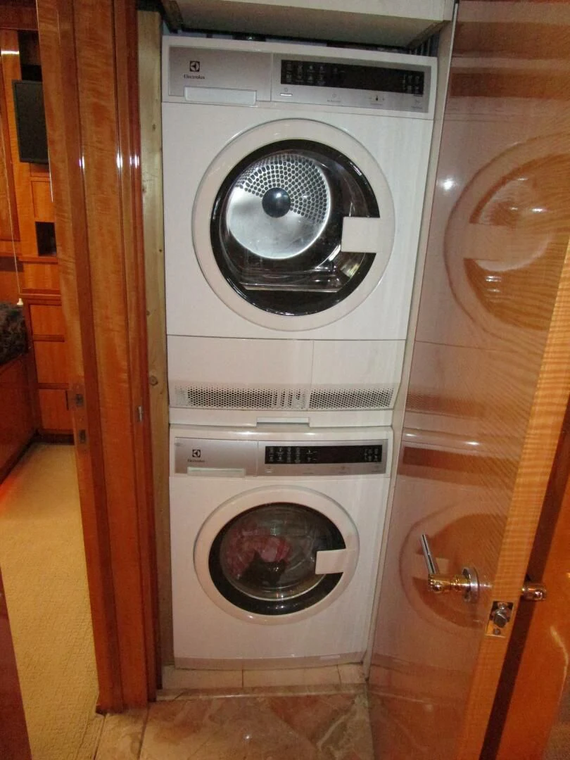 a washing machine in a room aboard CARPE DIEM Yacht for Charter