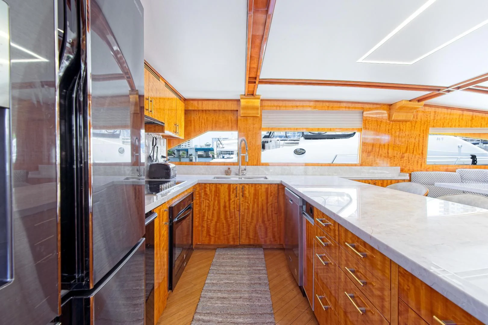 a kitchen with a large island aboard CARPE DIEM Yacht for Charter